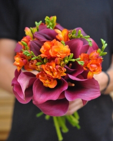 Flower bouquet with elegant freesia and calla lilies