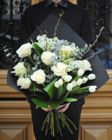 Funerary bouquet with roses, lilac and tulips
