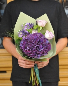 Flower bouquet with purple hydrangea and roses