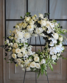 Funeral crown with roses, phalaenopsis and matthiola