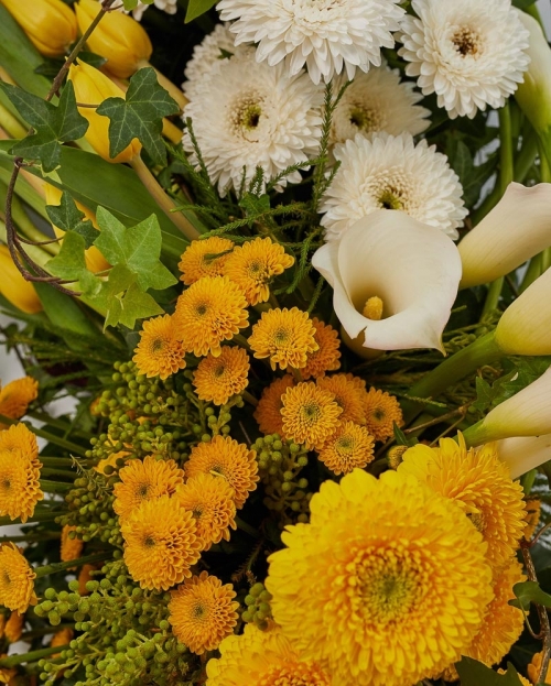 Funeral arrangement with gerbera and cala