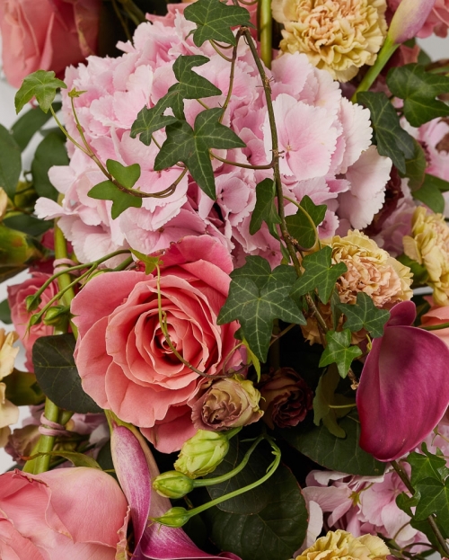 Funeral arrangement with hydrangea, cala and roses