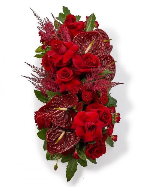 Funeral arrangement with roses and anthurium