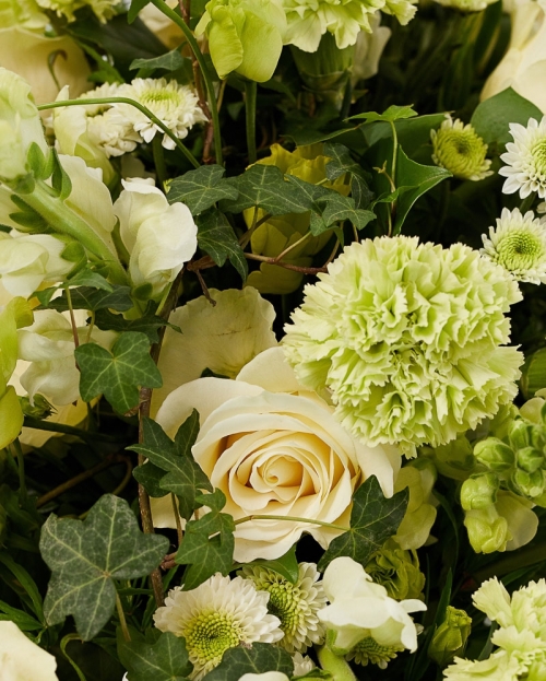 Funeral arrangement with roses and santini