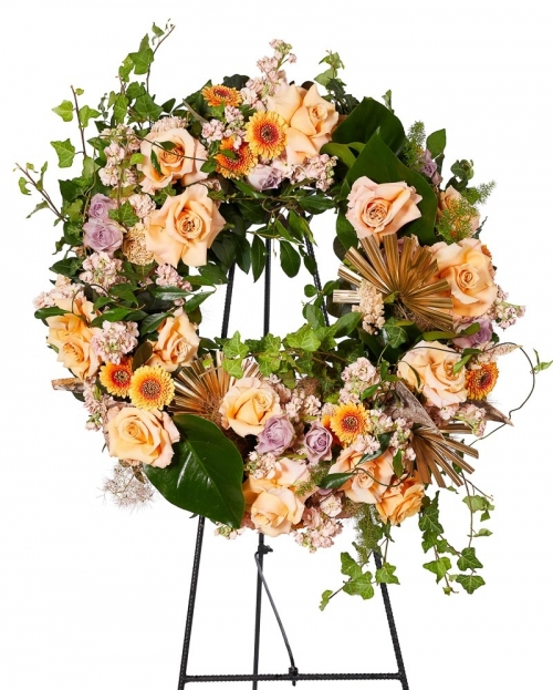 Funeral crown with roses and mathiola