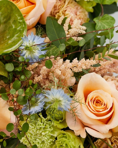 Funeral cross with roses and astilbe